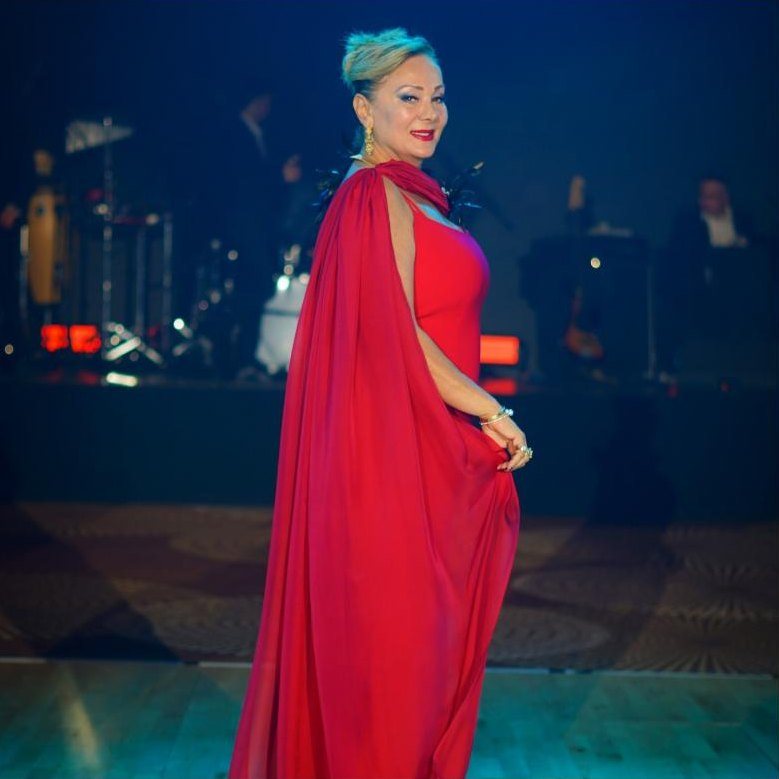 Lizi Mor in a red gown on the ballroom floor